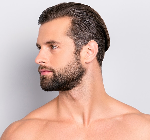 Profile side view half-faced portrait with copy space of handsome, sexy, athletic, confident, sporty, naked guy with perfect, ideal skin, isolated on gray background